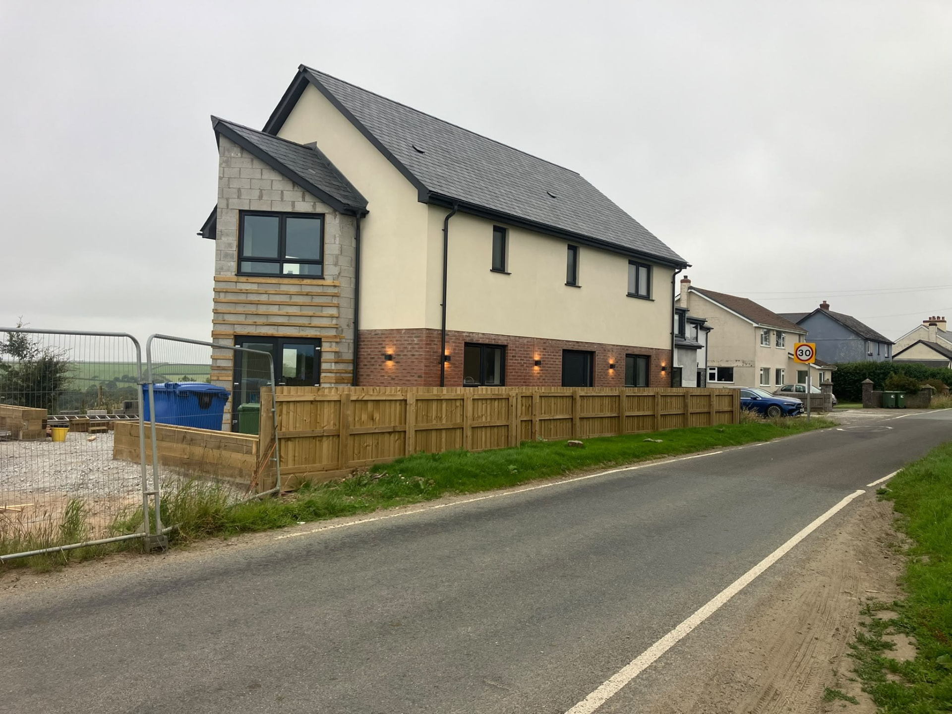 Newly completed detached house with render, brick and timber cladding built for a private client